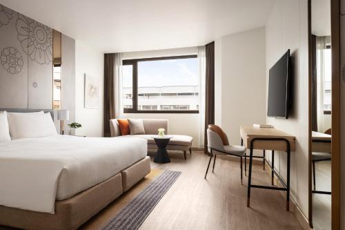 Ένα ή περισσότερα κρεβάτια σε δωμάτιο στο Amari Don Muang Airport Bangkok