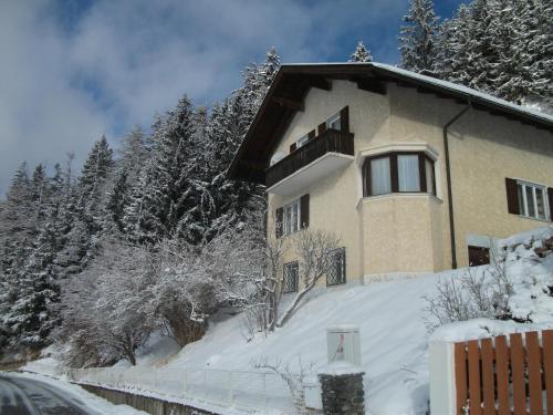 a house on a snow covered hill with trees at Ferienwohnung 2 Ferienhaus Gassner In Navis in Navis