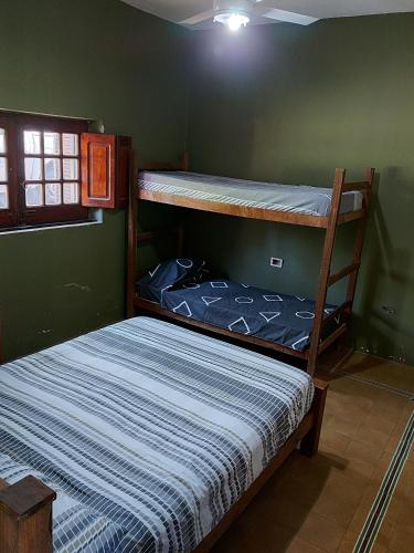 a bedroom with two bunk beds in a room at Rincon de la Selva in La Calera