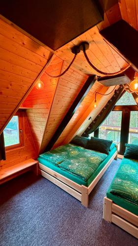 Postel nebo postele na pokoji v ubytování PARADiSE Wellness Chalet - Sauna&SPA Terchová