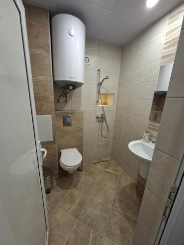 a bathroom with a toilet and a sink at Numbers in Ruse