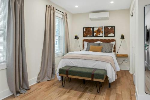 a bedroom with a large bed and a window at Glenbrook Suites in Stamford