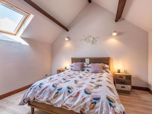 a bedroom with a large bed and a window at 1 bed in Machynlleth 85207 in Darowen
