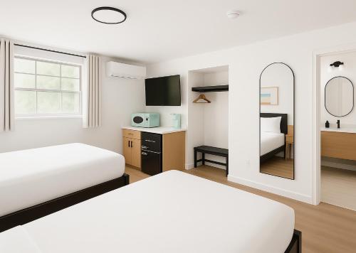 Postel nebo postele na pokoji v ubytování Sun & Sand Resort