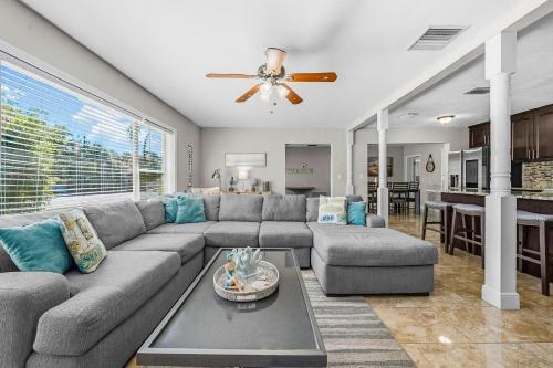 a living room with a couch and a table at Private 5BR Oasis with Pool Near Clearwater Beach in Clearwater