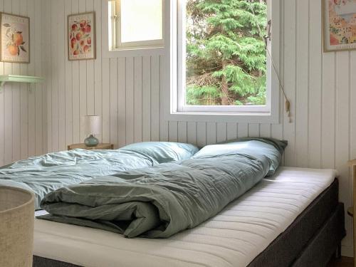 Ένα ή περισσότερα κρεβάτια σε δωμάτιο στο 4 star holiday home in Dannemare