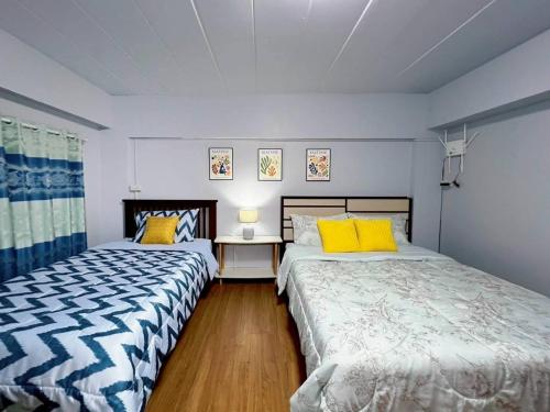 Ένα ή περισσότερα κρεβάτια σε δωμάτιο στο Bird Hostel Chiangrai