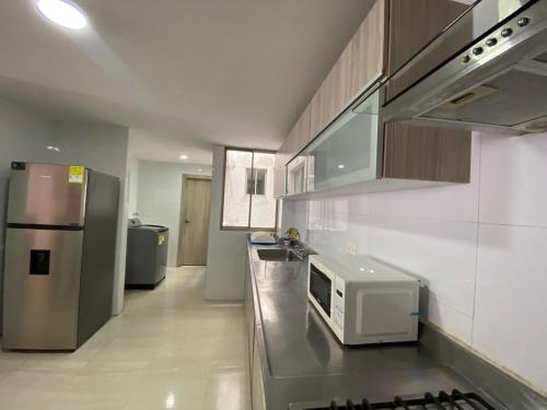 Kuchyň nebo kuchyňský kout v ubytování Your ideal stay in Barranquilla awaits