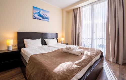 Ένα ή περισσότερα κρεβάτια σε δωμάτιο στο Stylish Stay at Loft 1 in New Gudauri