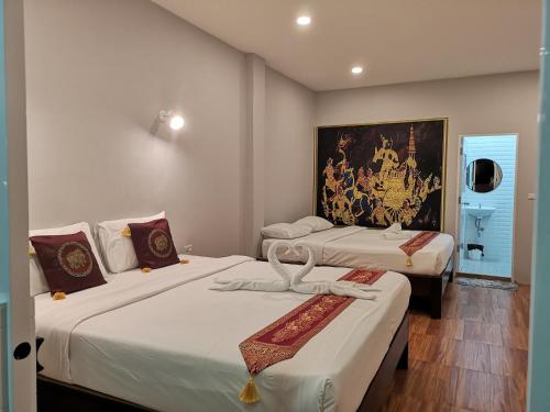 Ένα ή περισσότερα κρεβάτια σε δωμάτιο στο Near the Beach Cha-Am