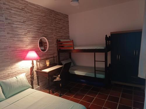 En eller flere senge i et værelse på Arco-íres do Sheyke