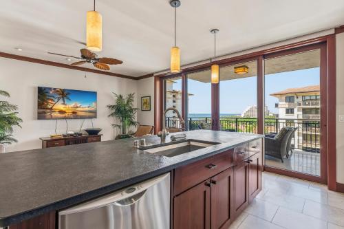 a kitchen with a sink and a large window at Beach Villas at Ko Olina 8th floor Ocean View in Kapolei