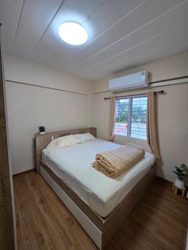 a bedroom with a large bed with a window at Cactus 2024 - 2 Bedroom 