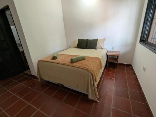 Ένα ή περισσότερα κρεβάτια σε δωμάτιο στο Casa Angela María