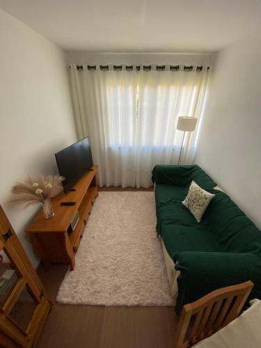 Et tv og/eller underholdning på Conforto e aconchego em São João del-Rei