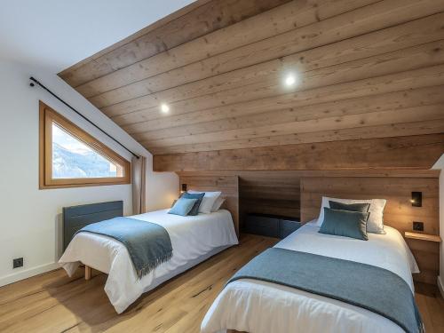 Ένα ή περισσότερα κρεβάτια σε δωμάτιο στο Appartement rénové 2 chambres, proche pistes, parking inclus - FR-1-566-85