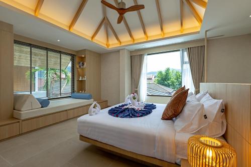 Ένα ή περισσότερα κρεβάτια σε δωμάτιο στο Kiang Tawan Villa 2