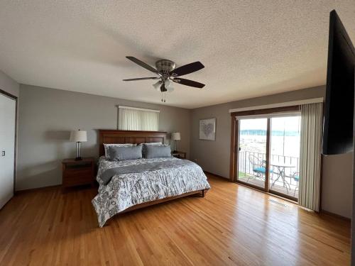 a bedroom with a bed and a ceiling fan at 600 Lakeshore home in Lake City