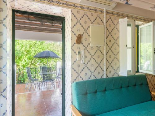 a living room with a couch and a patio at Wine Country Home in Alentejo in Montemor-o-Novo