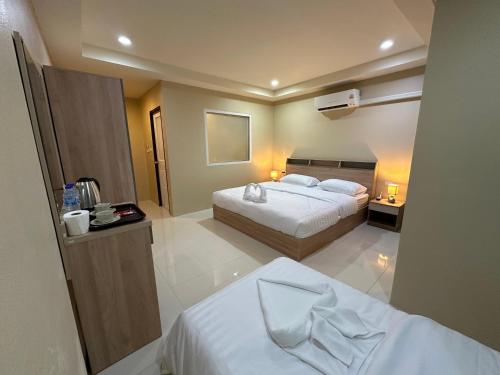 Ένα ή περισσότερα κρεβάτια σε δωμάτιο στο Lexis Residence - Newly Renovated Rooms