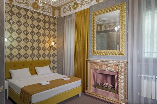 Ένα ή περισσότερα κρεβάτια σε δωμάτιο στο Nizami Boutique Hotel