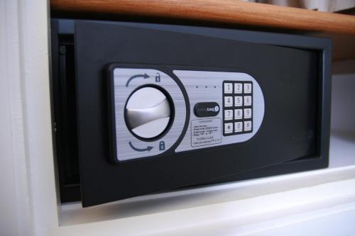 a microwave oven with a control panel on it at Hôtel & Appartements Monsigny in Nice