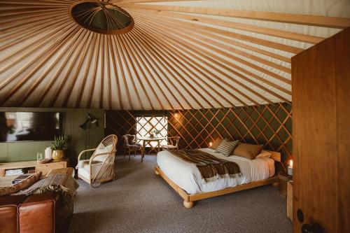 Ένα ή περισσότερα κρεβάτια σε δωμάτιο στο The Green Tent