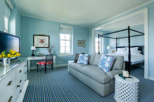 a living room with a couch and a bed at Congress Hall in Cape May