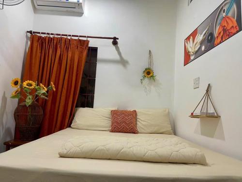 Ένα ή περισσότερα κρεβάτια σε δωμάτιο στο Homestay Mia Diệu Nhàn Phú Quốc