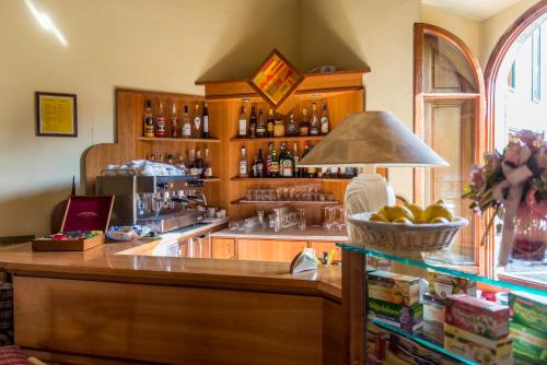 a kitchen with a bar with a counter top at Hotel Bellavista in Abetone