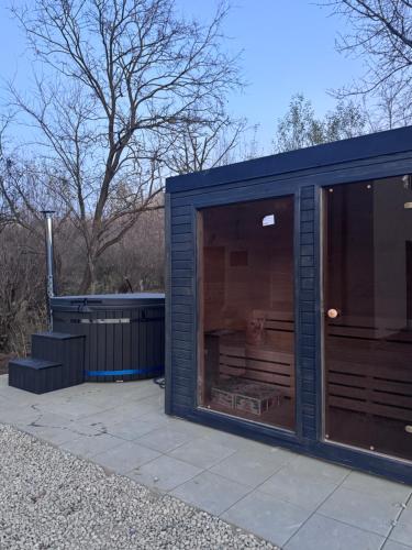 a large blue building with a large window at Willow32 Chalet in Braşov