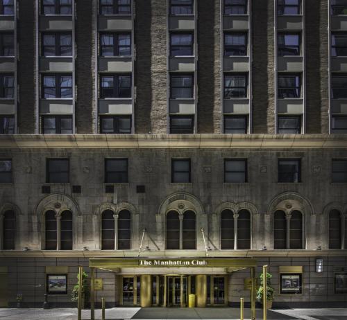 a large building with a clock on the side of it at The Manhattan Club in New York