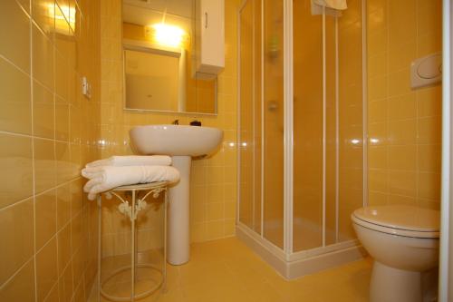 a bathroom with a sink and a toilet and a shower at My Hotel Milano in Milan