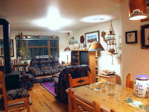 a living room with a couch and a table at Inn at Halona in Zuni