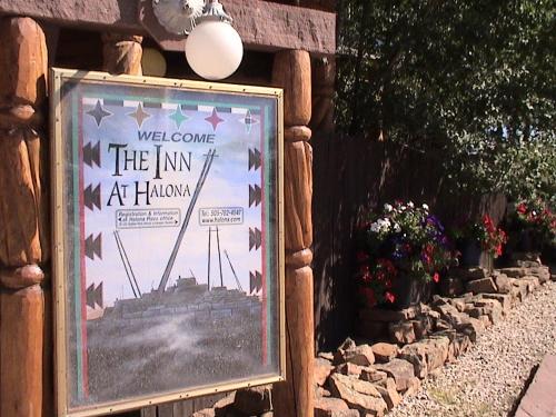 a sign that says welcome to the inn at horizons at Inn at Halona in Zuni