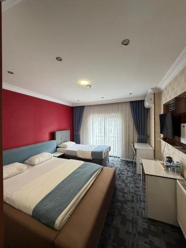 Ένα ή περισσότερα κρεβάτια σε δωμάτιο στο Hotel Dosco