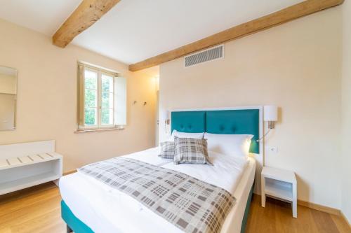 Postel nebo postele na pokoji v ubytování Al Torrione