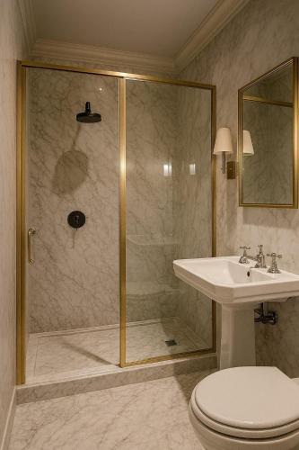 a bathroom with a shower and a toilet and a sink at Crystala 2 guest house in Aswan
