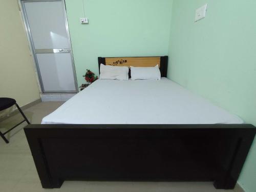 a large bed in a room with a white mattress at HOTEL O A.P PALACE in Dīgha