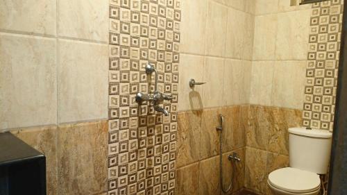 Koupelna v ubytování Candolim Beach Inn By RIH