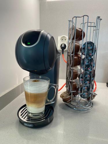 a coffee maker sitting on a counter with a cup of coffee at Casa Kempie in San Javier