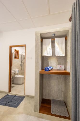 a bathroom with a sink and a mirror at Royal Sea Wind in Matara