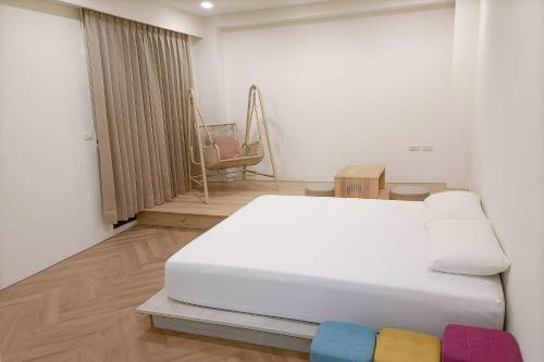 Postel nebo postele na pokoji v ubytování 冬山好朋友家 D-ong S-han good friend B&B