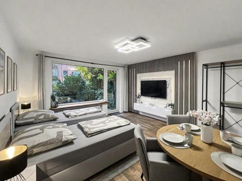 TV a/nebo společenská místnost v ubytování charmantes Apartment bei Hamburg - Ruhe, Komfort & kostenloses Parken