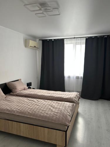 Ένα ή περισσότερα κρεβάτια σε δωμάτιο στο Апартаменти