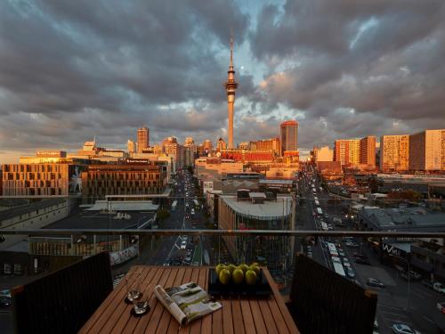 a view of a city from a balcony with a city at Swiss-Belsuites Victoria Park Auckland in Auckland