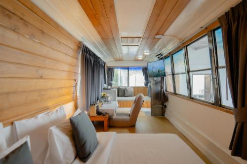 Ένα ή περισσότερα κρεβάτια σε δωμάτιο στο Arroon Chiang Rai, Thailand