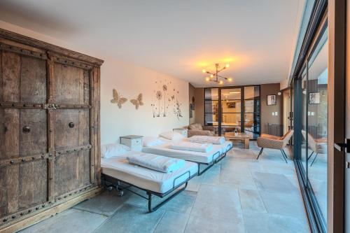 Una cama o camas en una habitación de vakantiewoning Terminus