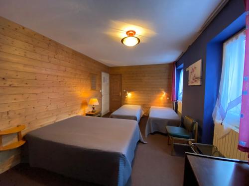 Ένα ή περισσότερα κρεβάτια σε δωμάτιο στο Appartement residence les Marmottes