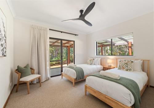 Voodi või voodid majutusasutuse Whisperwood toas